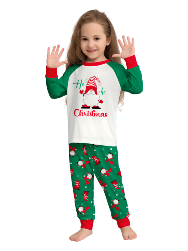 The bearded Santa buried under his gigantic hat, matching family pyjamas